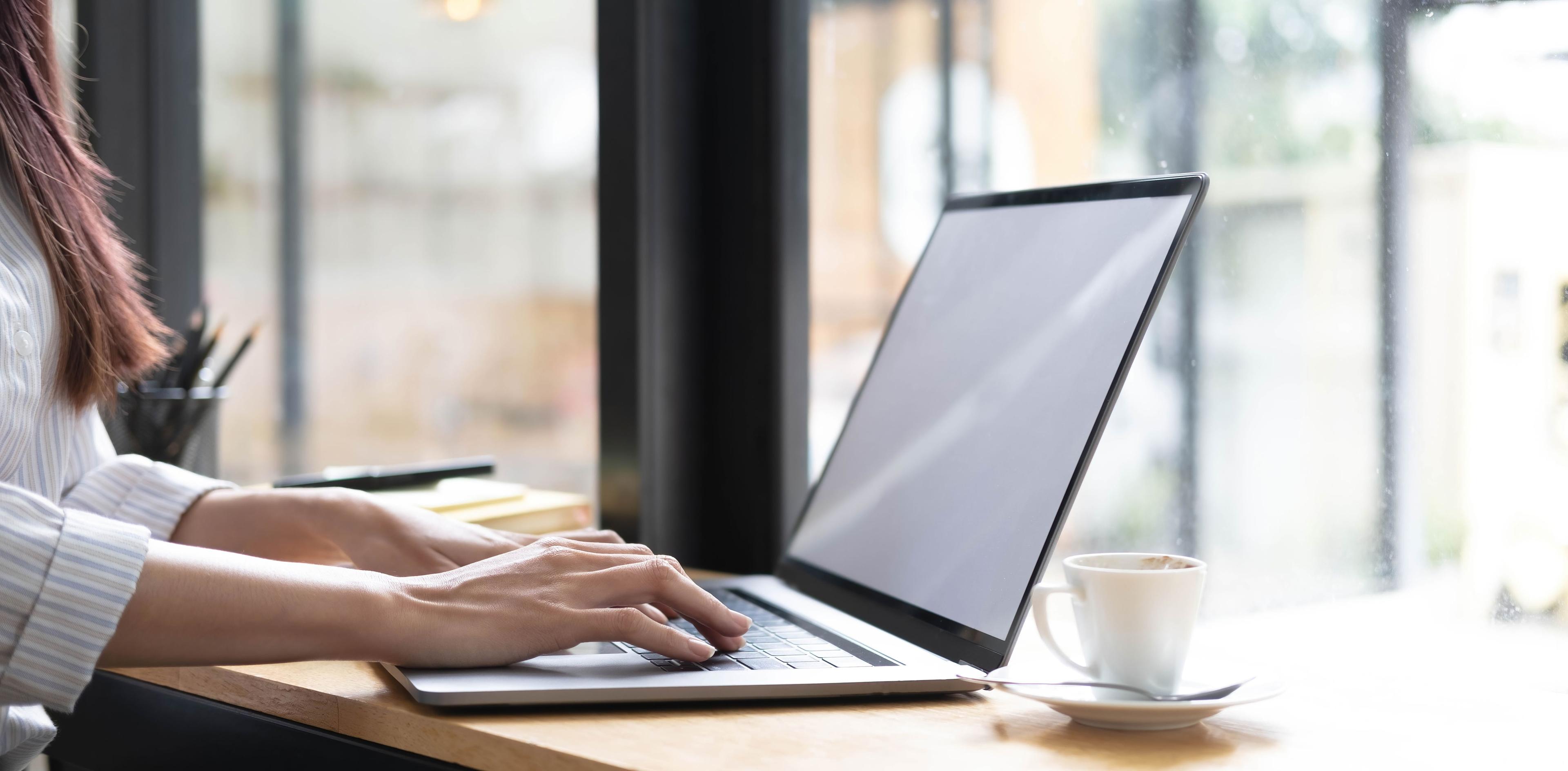 vecteezy_businesswoman-s-handis-typing-a-keyboard-on-a-laptop-with-a_8142359